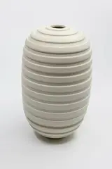 Ribbed oval vase by John Parker, matt white glaze, sold Sep 2024