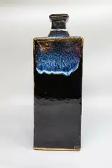 Very large square bottle vase by Len Castle, stoneware slab vase with jun glaze over tenmoku, sold Sep 2024