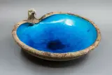 Sea Hawk bowl by Len Castle, earthenware with alkaline blue glazed interior and silica-rubbed oxide exterior, sold Sep 2024