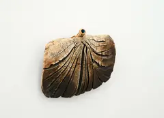 Hanging bottle by Len Castle, iron oxide-washed stoneware with textured finish and blue glaze to the interior, sold Sep 2024