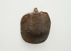 Hanging bottle by Len Castle, stoneware with textured ribbing pattern and bead motifs around the neck, sold Sep 2024