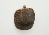 Hanging bottle by Len Castle, stoneware with textured ribbing pattern and bead motifs around the neck, sold Sep 2024