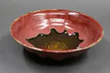 Graeme Storm, Porcelain bowl, with poured copper red glaze over light brown glaze