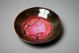 Len Castle, Stoneware dish, with gestural wax-resist decoration on tenmoku and purple glazes