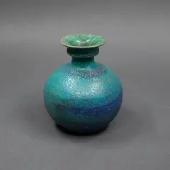 Small ovoid vase by Graeme Storm, stoneware with thick matt blue and green barium glaze, sold Sep 2024