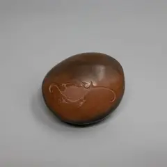 Robyn Stewart, Dung fired and burnished form, with incised cave art decoration