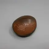 Robyn Stewart, Dung fired and burnished form, with incised cave art decoration