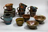 New Zealand Studio Pottery, A collection of cups and bowls, comprising six Graeme Storm cups and saucers, four Peter Stichbury tea bowls and a milk jug