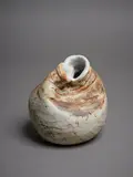 Rosemarie Brittain, Double aperture vase, ceramic of deliberately altered form with amber matte glaze and textural effects