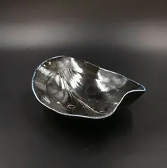Chris Weaver, Porcelain salt fired shaped bowl, in dark blue, decorated with stylized leaf design