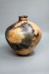 Potter Unknown, Dung fired and burnished ceramic vase, with wax resist leaf decoration