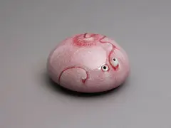Aimée McLeod, Small red flambé glazed paperweight, porcelain