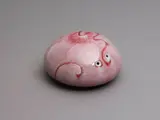 Aimée McLeod, Small red flambé glazed paperweight, porcelain