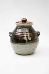 Potter Unknown, Large stoneware lidded jar, with tenmoku and ash glazes