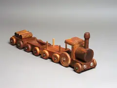 Train Set by Bill Hammond, carved wood and metal, four parts, circa 1974, offered Aug 2024