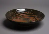 Len Castle, Large stoneware bowl, with tenmoku wax resist gestural decoration