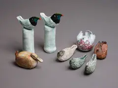 Rosemarie Brittain, Group of eight assorted ceramic birds, comprising a pair of toucans, a duck, two rounded winged birds and three smaller ones (AF)