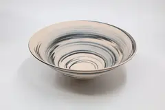 Agate ware bowl by John Parker, unglazed ceramic with straight flaring sides (small crack to the foot), offered May 2024