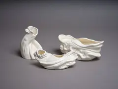 Collection of three twisted bark-shaped vases by Crown Lynn Potteries, white slip-cast ceramic, sold May 2024