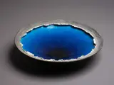 Crater Lake bowl by Len Castle, earthenware with alkaline blue glaze to the interior, shiny black to the exterior, sold May 2024