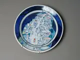 Roy Cowan, Wellington street scene charger, glazed stoneware with painted decoration, with wall mounts