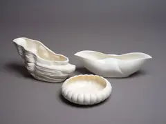 Collection of three trough vases by Crown Lynn Potteries, white slip-cast ceramic, comprising a driftwood shaped vase, a buffalo horn shaped vase and a float bowl, sold May 2024