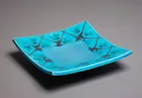 Merilyn Wiseman, Large square ceramic platter, in bright turquoise glaze with abstract orange and green decoration to the rim (small repair)