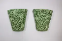 Pair of wall vases by Crown Lynn Potteries, of flared trunk form with green glaze, sold May 2024