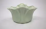 Fluted mantle vase by Crown Lynn Potteries, slip-cast ceramic with matt pale green glaze, sold May 2024