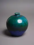 Stem vase by Graeme Storm, stoneware with thick, vivid green poured to the shoulders over barium blue glaze, sold May 2024