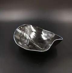 Chris Weaver, Porcelain salt fired shaped bowl, in dark blue, decorated with stylized leaf design