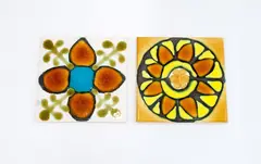 Charles Holmes, Two tiles (1978), glazed ceramics decorated with stylised floral motifs