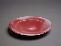 Greg Barron, Circular platter, with red flambé glaze with mushroom highlights