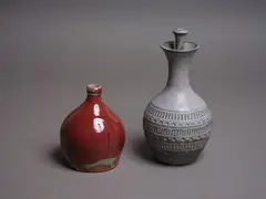 Nz Studio Pottery, Two stoneware bottles, comprising a Michael Block lidded bottle and a smaller red flambé bottle by an unidentified potter