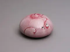 Aimée McLeod, Small red flambé glazed paperweight, porcelain