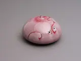 Aimée McLeod, Small red flambé glazed paperweight, porcelain