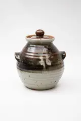 Large stoneware lidded jar by Potter Unknown, with tenmoku and ash glazes, offered May 2024