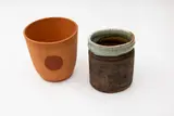 Terracotta vase by Phoenix Pottery (Michael Lucas & Jill Totty), printed potters' marks to the base; together with an unmarked stoneware jar, offered May 2024