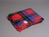 Kaiapoi Textiles Ltd, Clan travel rug, with a MacPherson tartan pattern in red, blue, green, black, yellow and white