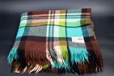 Kaiapoi Textiles Ltd, Huia travel Rug, in a brown, light blue, green, black and white tartan design (slight wear)
