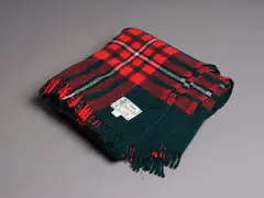 Kaiapoi Textiles Ltd, Clan travel rug, with a Princess Margaret tartan pattern in red, green, black and white