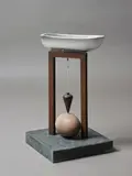 Peter Tilley, The Comedy of Denial, carved and painted timber, silver leaf, eggshell, plumb bob