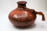 Robyn Stewart, Large jar, dung-fired and burnished ceramic with polished orange-brown surface, rope handle (chip to rim)
