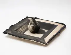 Ann Verdcourt, Dish with pear, black stained stoneware