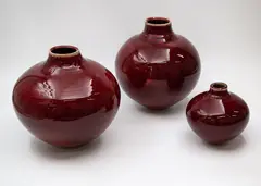 Campbell Hegan, Three ovoid vases, ceramics with sang de boeuf glaze