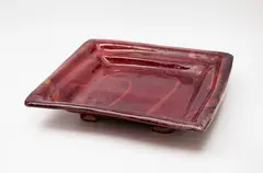 Doreen Blumhardt, Large square platter, stoneware with flambé glaze with red and purple tones, on raised feet