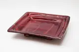Doreen Blumhardt, Large square platter, stoneware with flambé glaze with red and purple tones, on raised feet