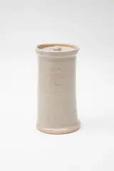 Cylindrical lidded jar by Barry Brickell, stoneware with pale grey ash glaze, sold Feb 2024