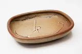 Len Castle, Stoneware platter, with wax resist gestural decoration