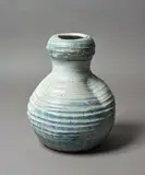 Len Castle, Large gourd form stoneware vase, with gnarled rim and scored sides in heavy feldspathic matt white glaze with blue and olive highlights